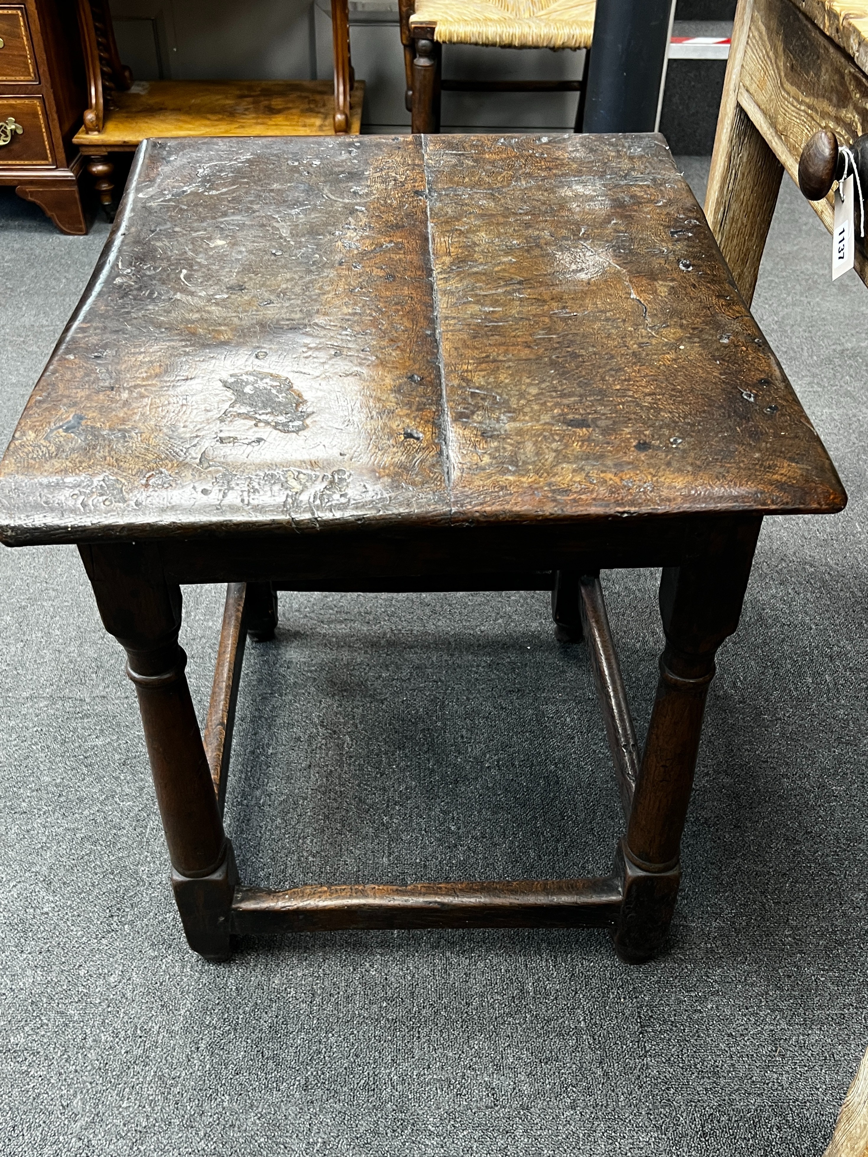 A 17th century rectangular oak small table with twin planked top, width 62cm, depth 52cm, height 61cm